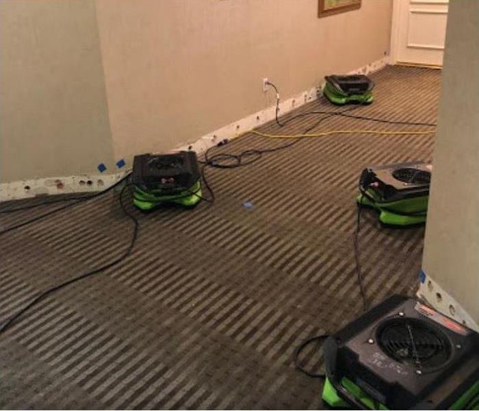 SERVPRO restoration equipment being used to dry water damaged carpet