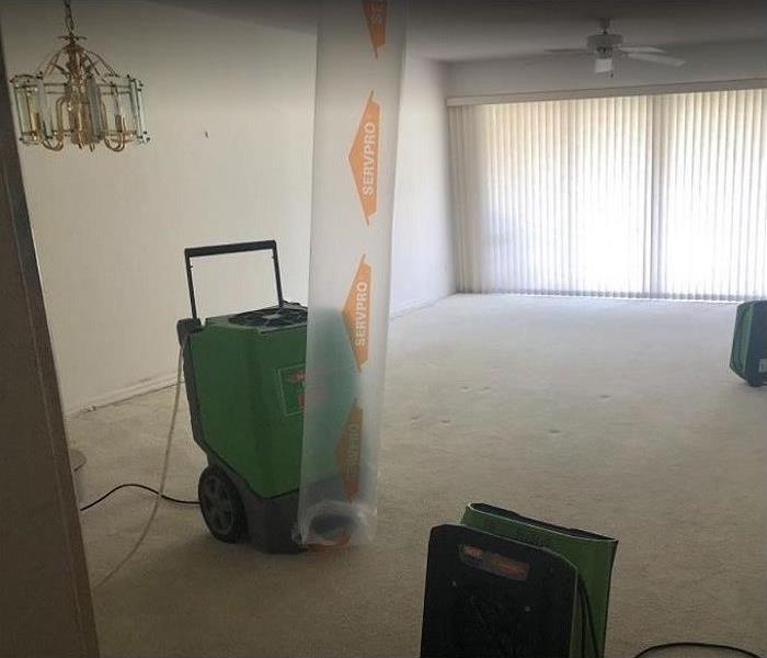 SERVPRO drying equipment being used to dry storm damaged room