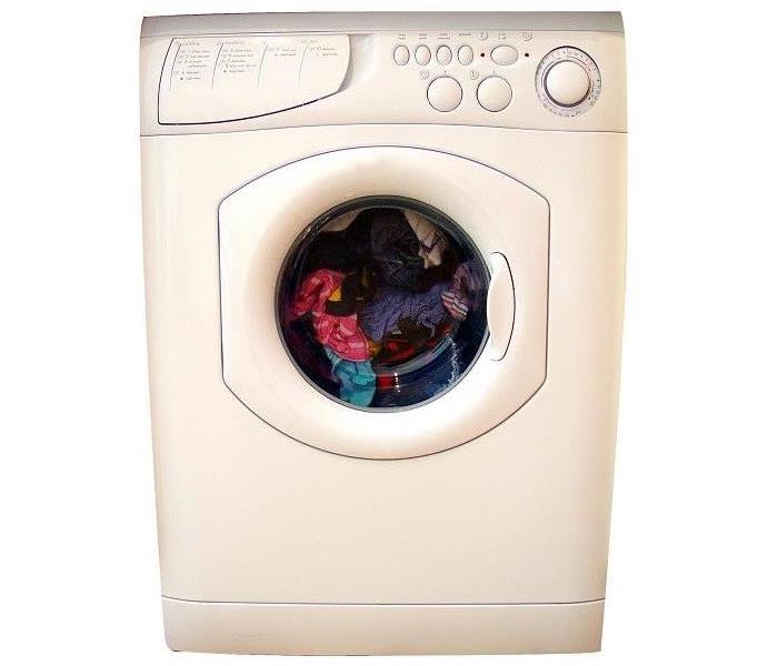 Front loading washing machine with clothes inside