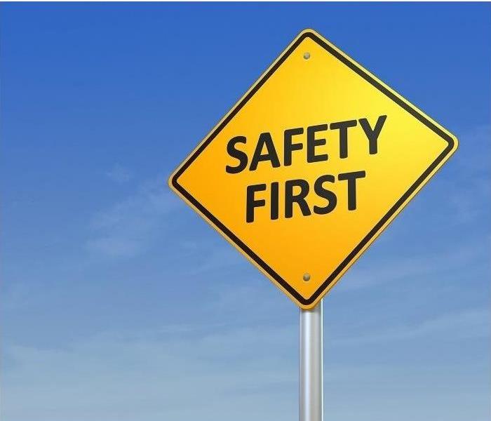 ‘Safety First’ sign against blue sky background