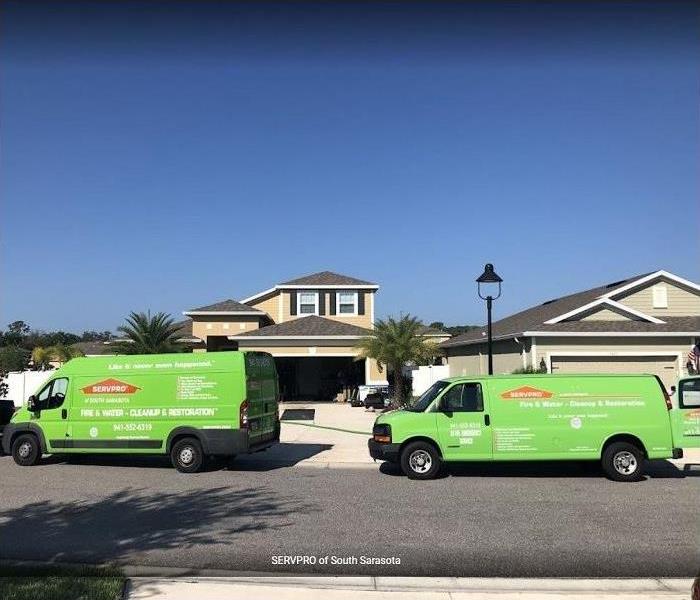 SERVPRO vehicles in front of home