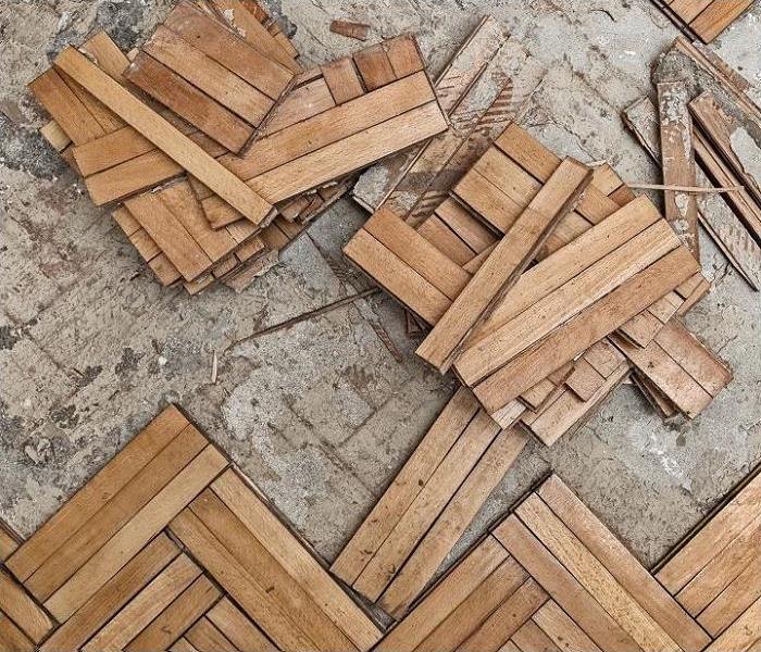 Water damaged hardwood floor: flooring strips removed because of damage